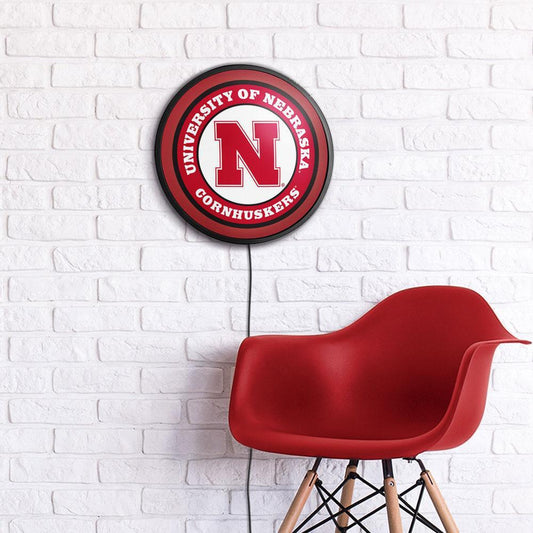 Nebraska Cornhuskers Slimline Round Lighted Wall Sign Room View
