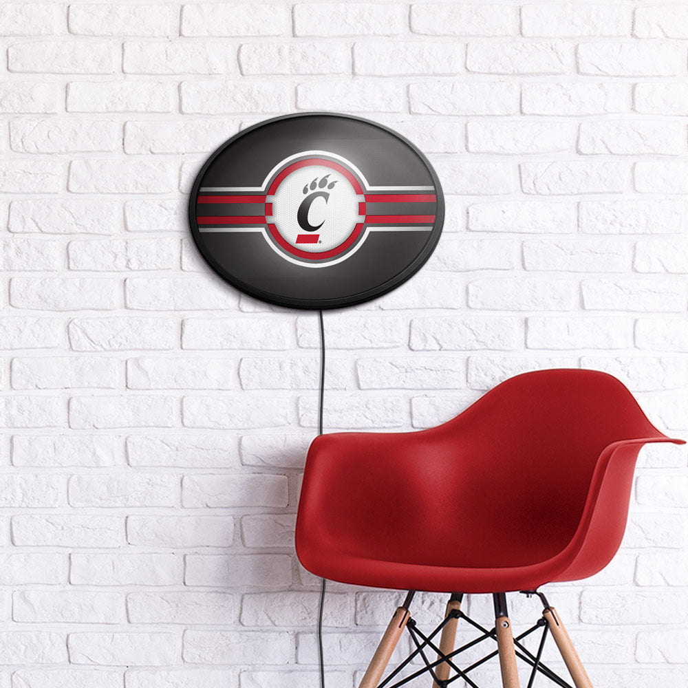 Cincinnati Bearcats Slimline Oval Lighted Wall Sign Room View