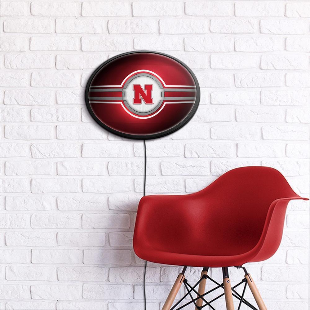 Nebraska Cornhuskers Slimline Oval Lighted Wall Sign Room View